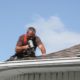 A photo depicting the process of repairing hail roof damage
