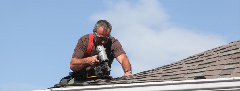 A photo depicting the process of repairing hail roof damage
