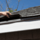 An illustration of fixing curled and cracked shingles on a roof.