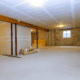 An illustration of interior waterproofing measures for a basement.