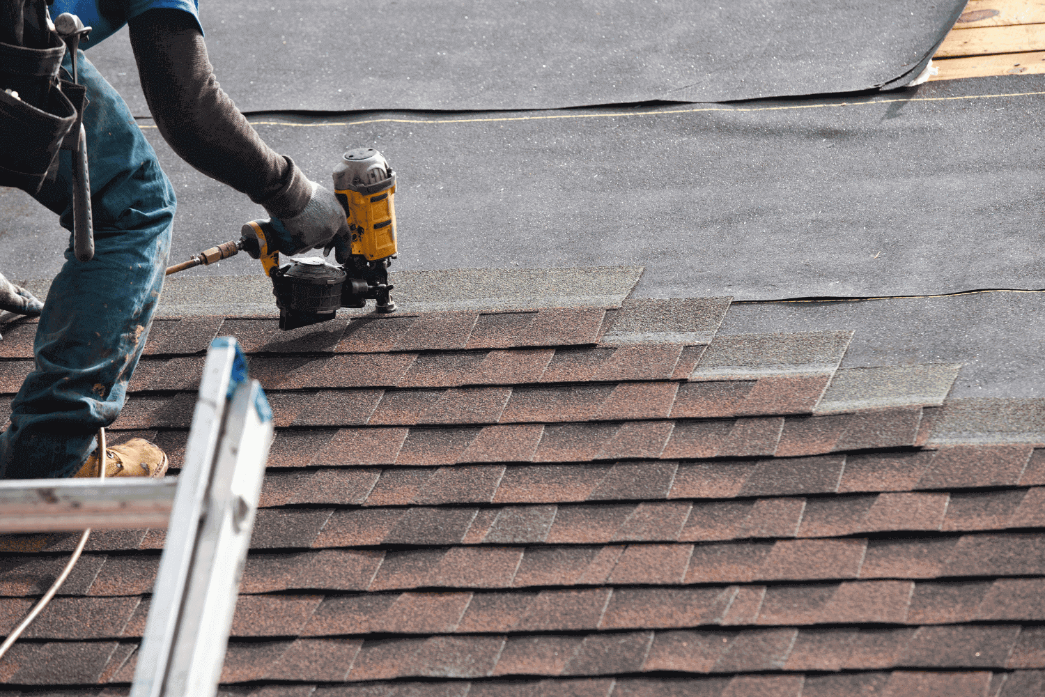 Different types of roofing materials including asphalt shingles and metal roofs.