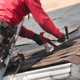 A variety of roofing materials including asphalt shingles and roofing tools