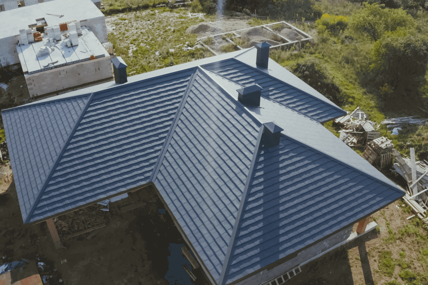 An image of the preparation process for roof panels before ridge cap installation