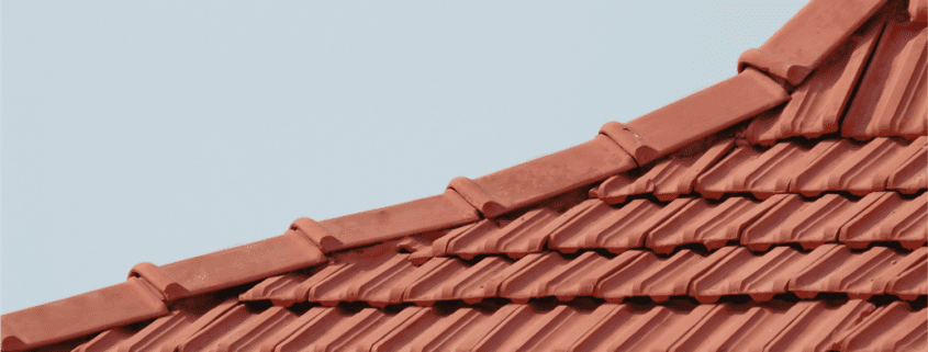 An overview of minimum roof slope for shingles, featuring various types of roofs