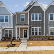 Various types of siding materials displayed on homes.