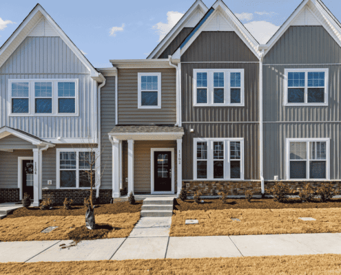 Various types of siding materials displayed on homes.