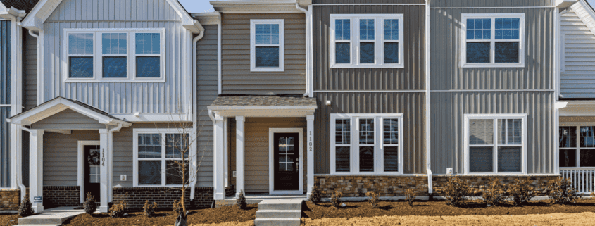 Various types of siding materials displayed on homes.