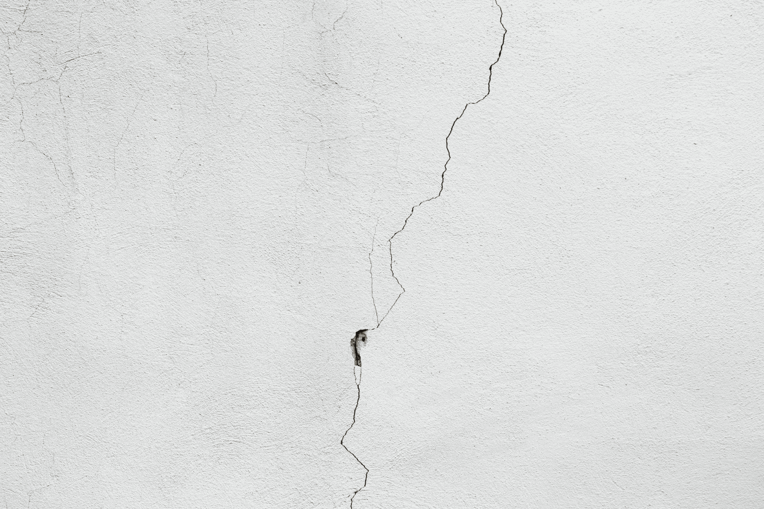 When to Worry About Cracks in Foundation: Warning Signs 4 Different types of foundation cracks including hairline and structural cracks.