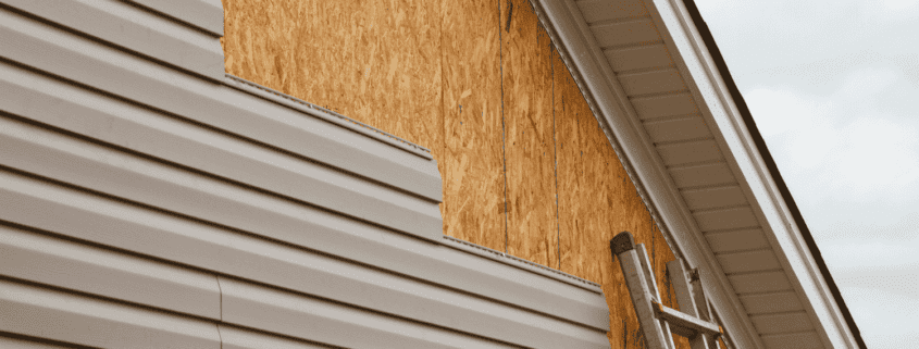 Replacing a damaged panel of vinyl siding.