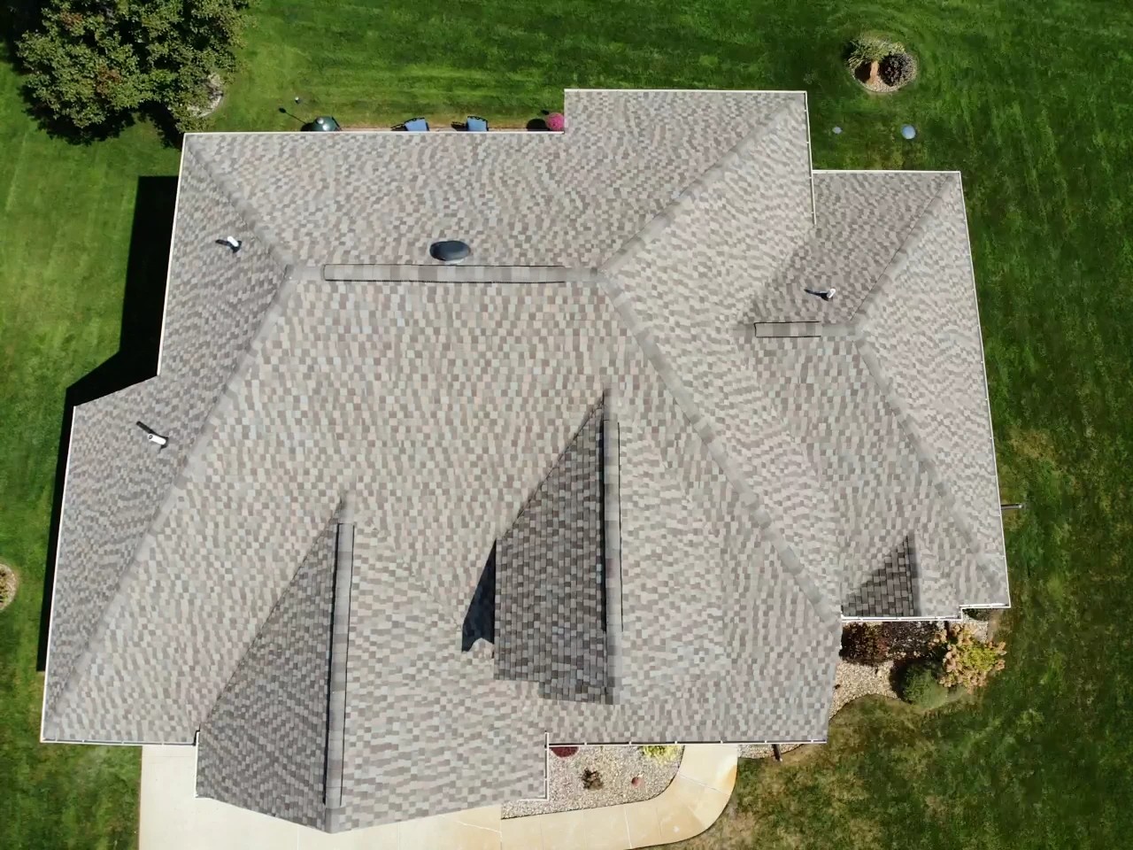 Elkhart, IN 2 An overhead aerial view reveals a multi-gabled shingle roof, highlighting the craft of professional roofing services.