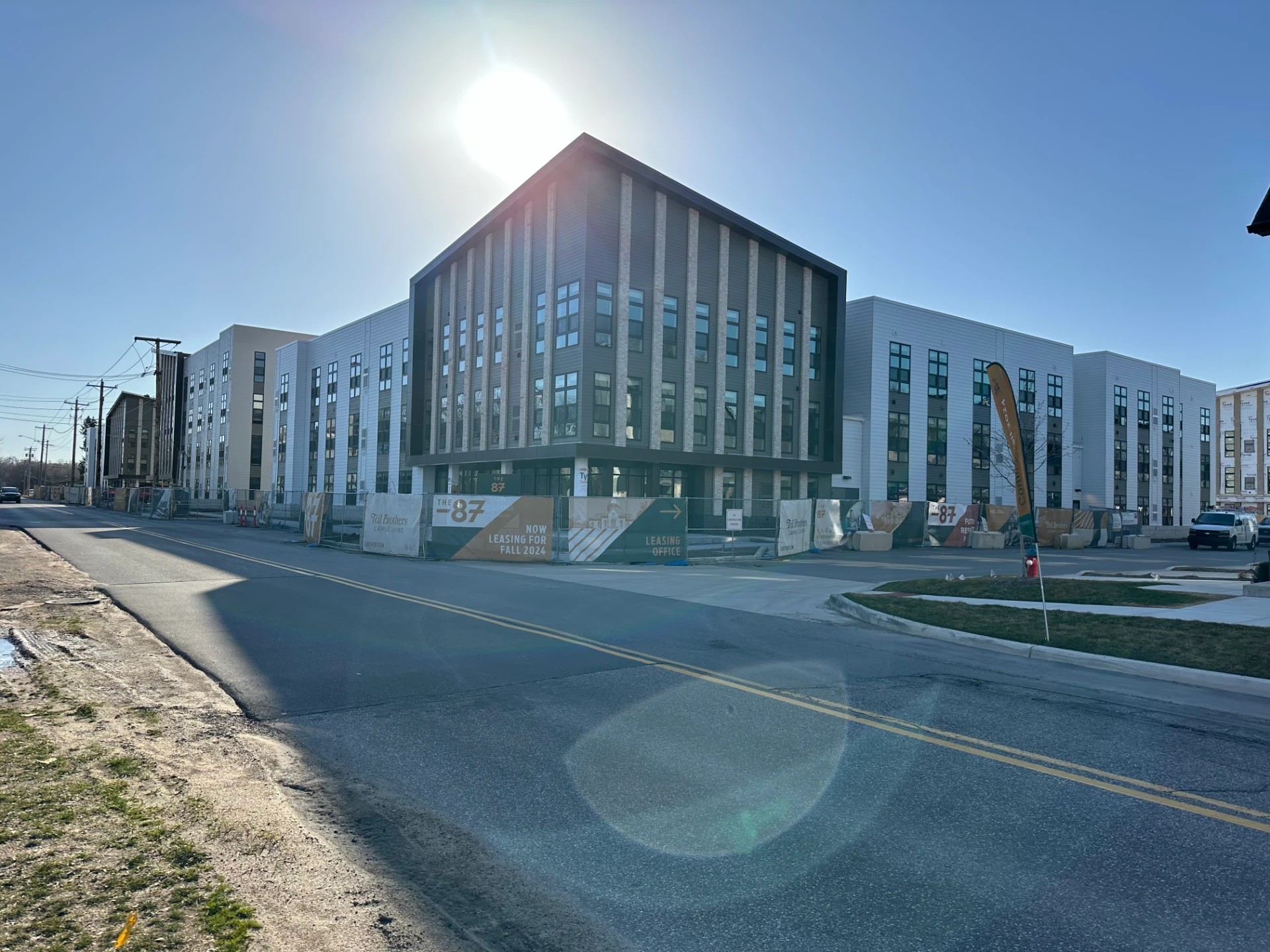 Donaldson, IN 2 A modern multi-story apartment complex features flat roofing completed with expert roofing services.